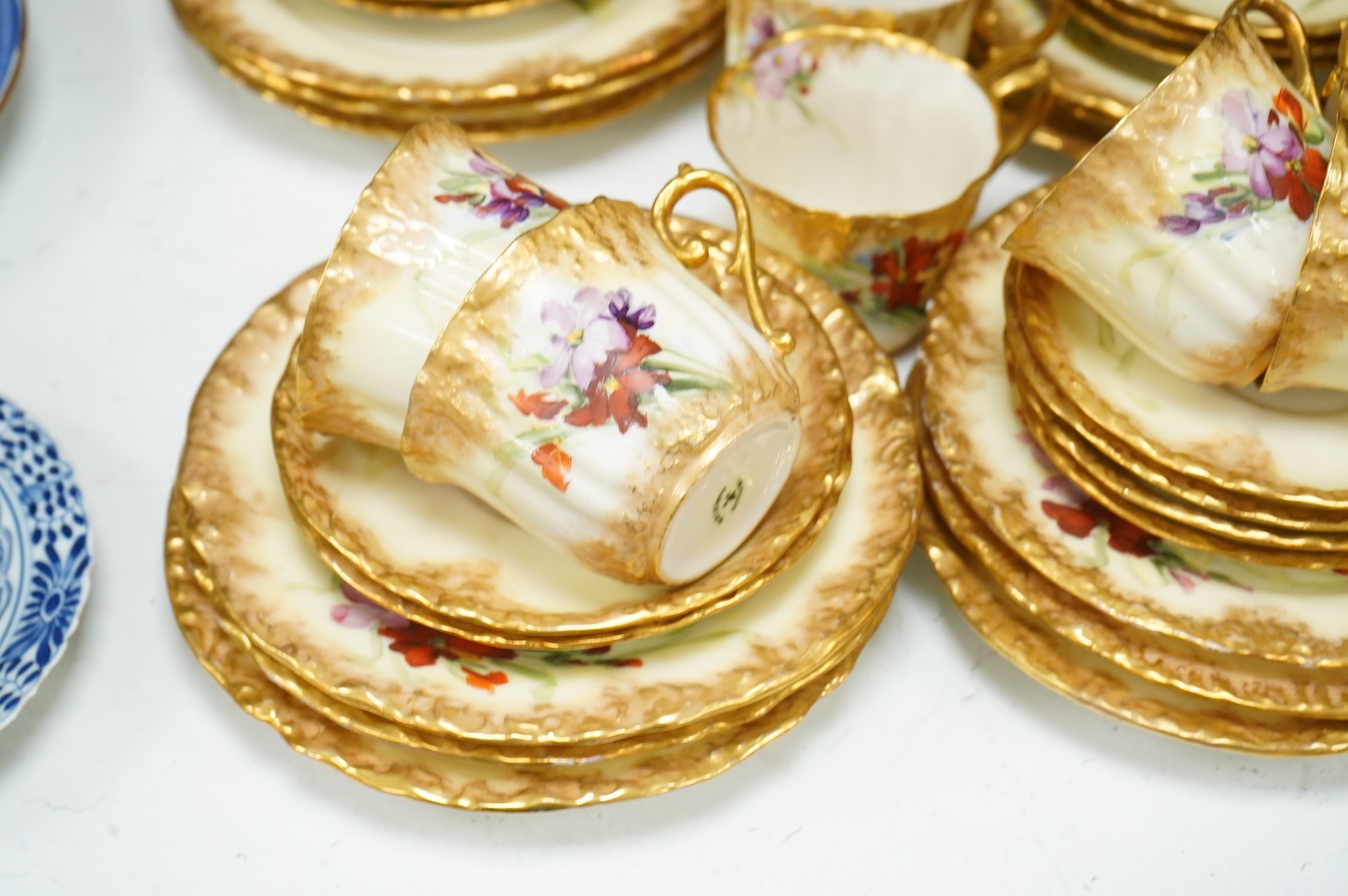 A ‘Nautilus’ porcelain floral and gilt decorated tea service, sandwich plates 23cm diameter.